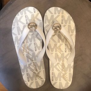 white michael kors flip flops